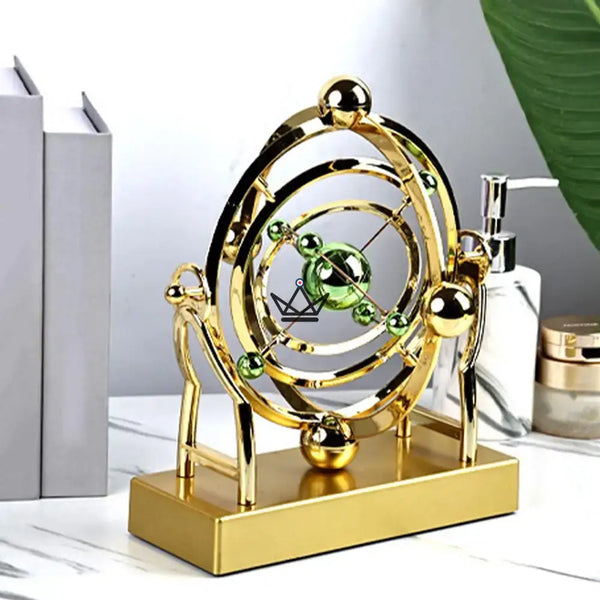 Sculpture cinétique de bureau orbite céleste dorée - ASTRALIS